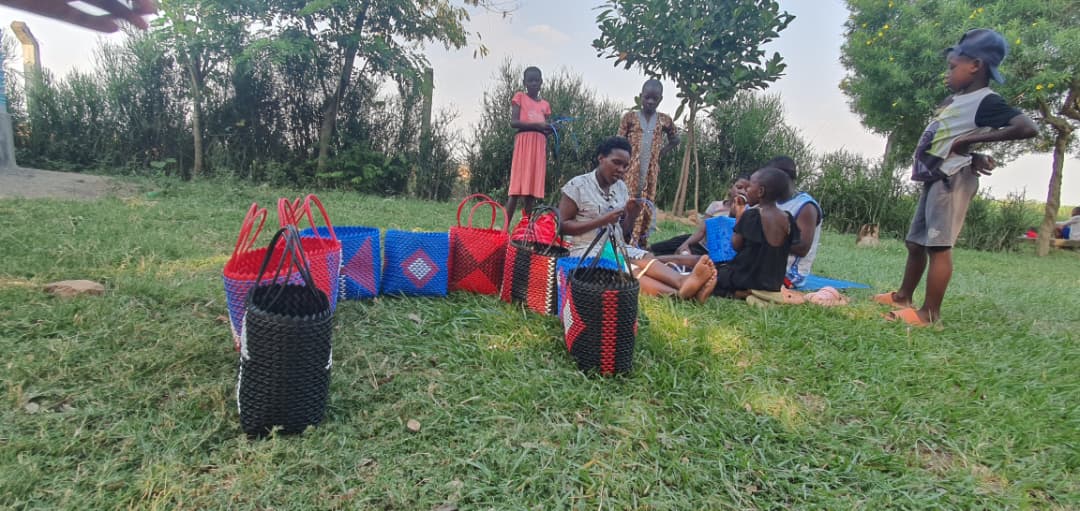 Participants holding handmade baskets outdoors