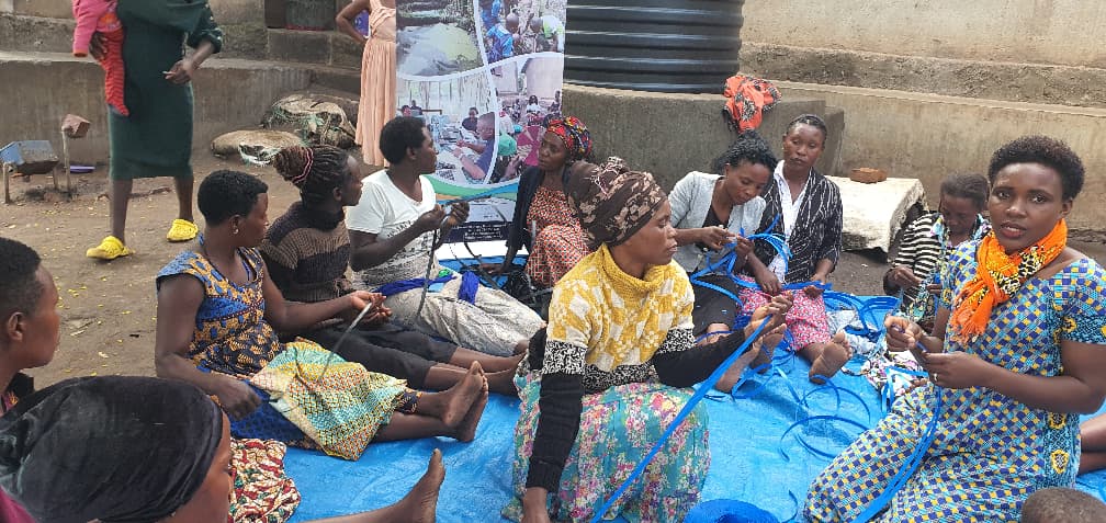 Participants in a basket-making skills session